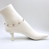 the crystal baroque charm dangles at the end of the chain