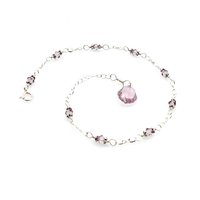 nine tiny crystal beads with sterling silver chain links in between