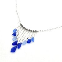 a handcrafted genuine sea glass necklace in the colors of cobalt blue and cornflower blue