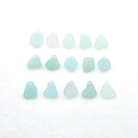 assorted light pastel colors in shades of blue, green and one pink