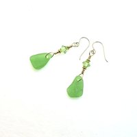 the real sea glass is drilled by me into small charms that dangle at the bottom of the earrings