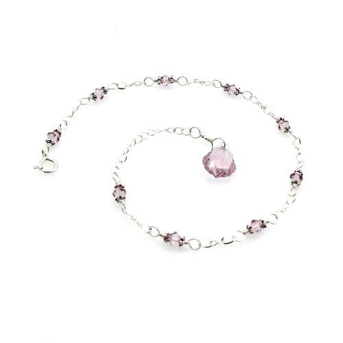 nine tiny crystal beads with sterling silver chain links in between