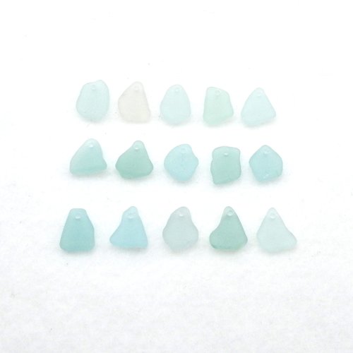 assorted light pastel colors in shades of blue, green and one pink